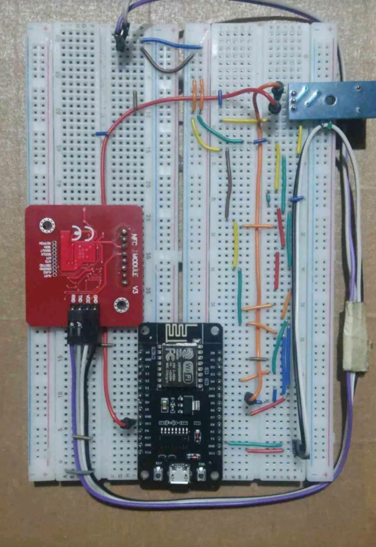RFID attendance hardware assembly with an ESP8266 board, PN532 NFC module, and breadboard wiring